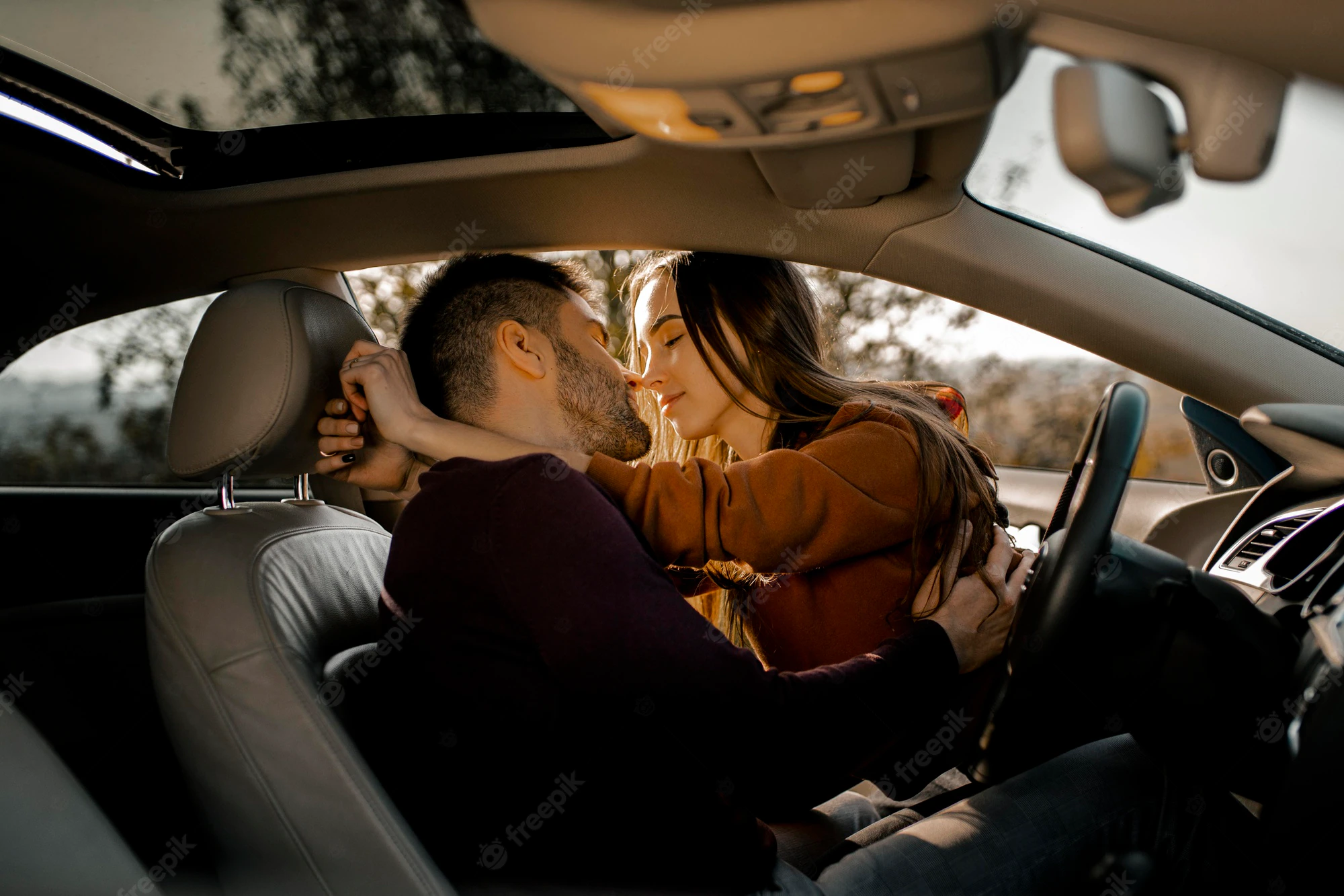 Medium Shot Couple Being Romantic Car 23 2148755735 1