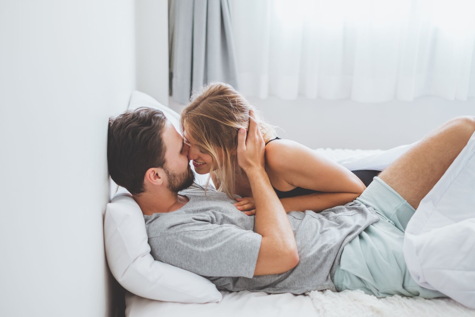 Young Couple Kissing On Bed Royalty Free Image 1644331537